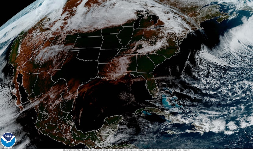 Texas counties on the eclipse's path appear in darkness on this GOES satellite image...