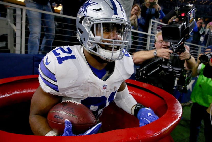 ARLINGTON, TX - DECEMBER 18:  Ezekiel Elliott #21 of the Dallas Cowboys celebrates after...