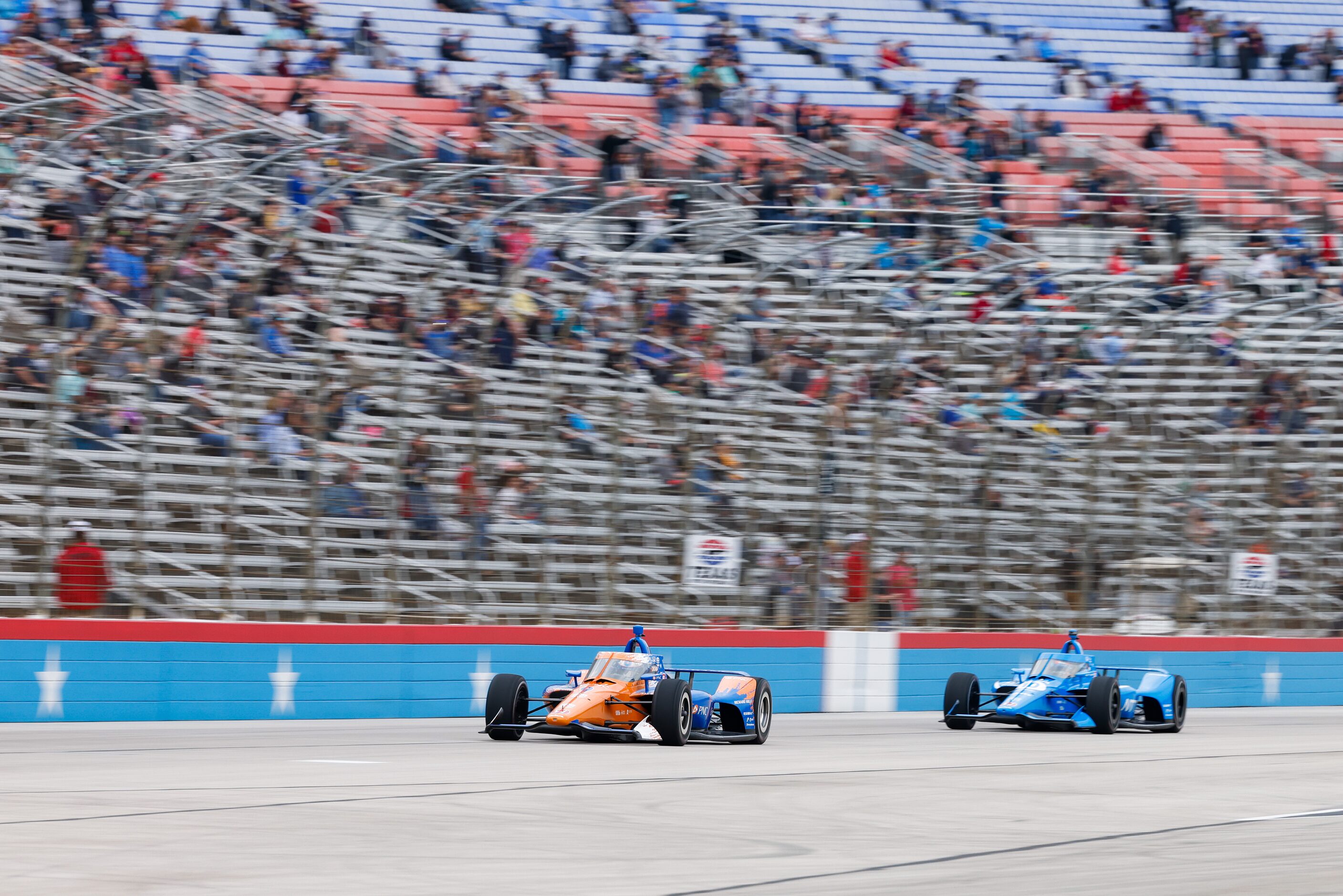 Scott Dixon (#9) leads in front of Alex Palou (#10) during the beginning laps of the IndyCar...