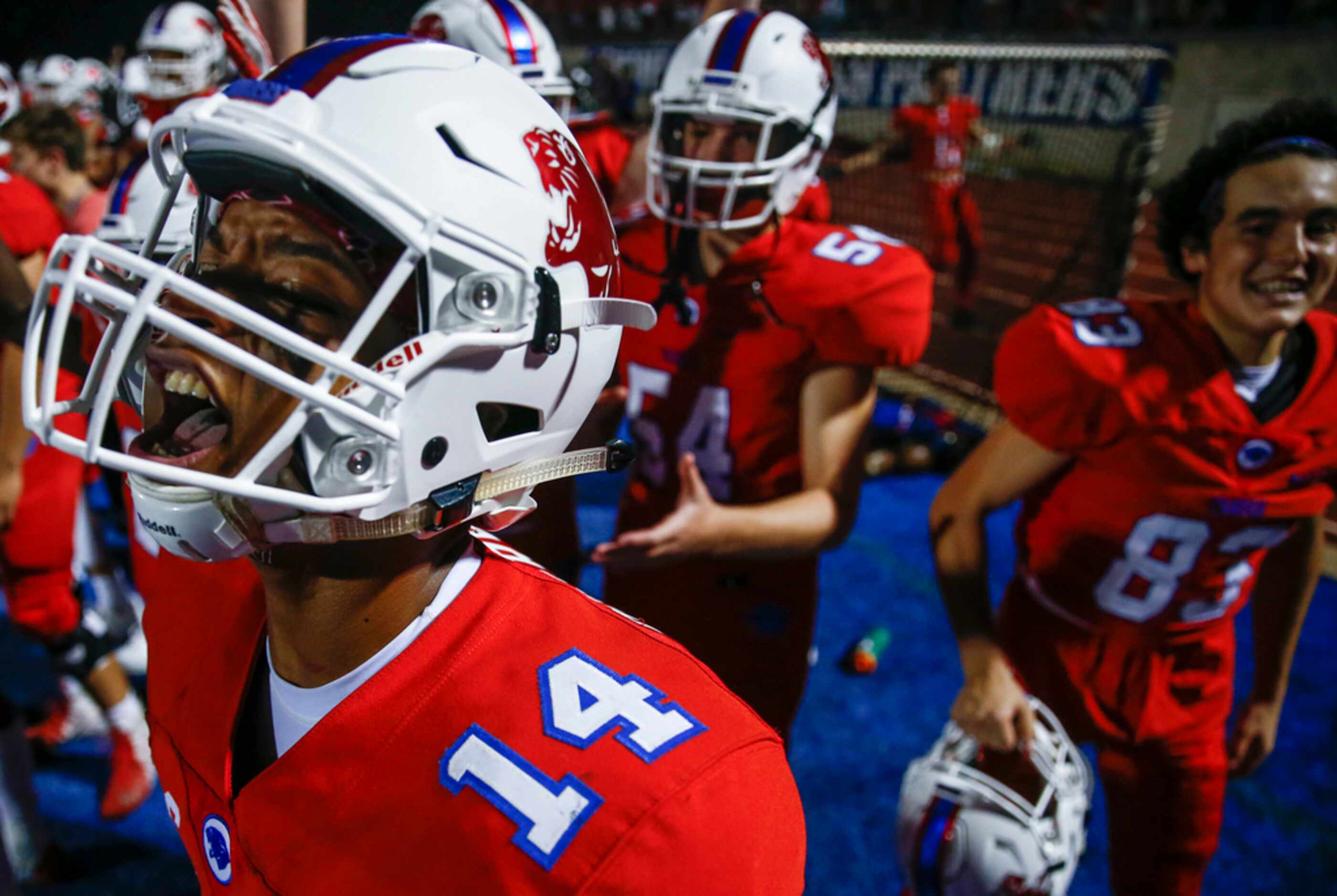 Parish Episcopal's Daniel Demery celebrates from the sideline after a Panther touchdown...