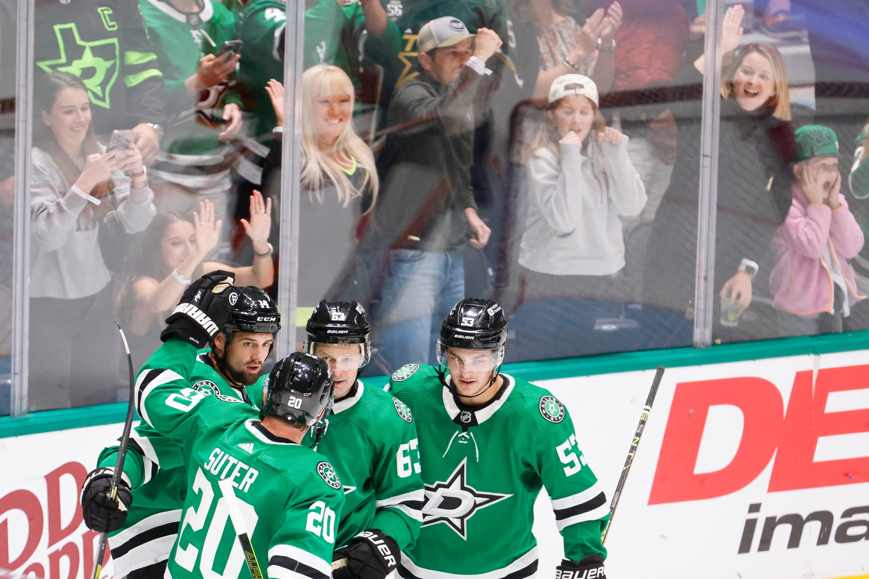 Dallas Stars left wing Jamie Benn (left) celebrates a goal with his teammate during the...