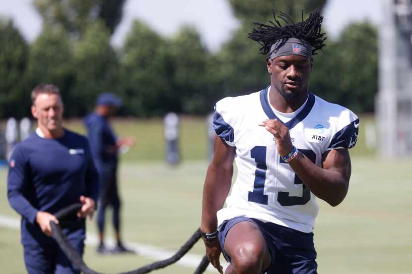 Dallas Cowboy’s wide receiver Michael Gallup (13) works with a resistance band during a...