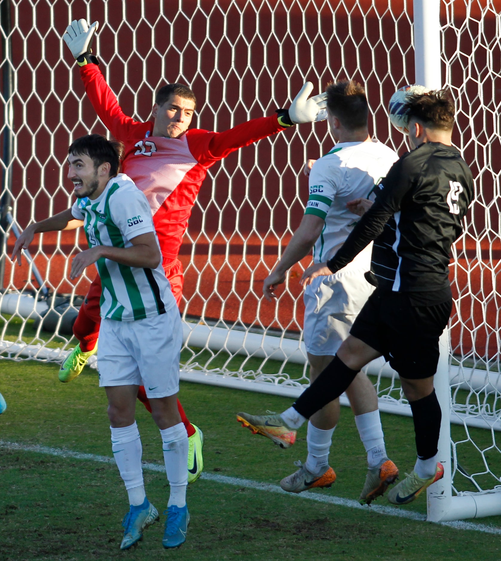 SMU forward Milton Lopez (19), right, heads a shot just inside the corner post for a goal as...