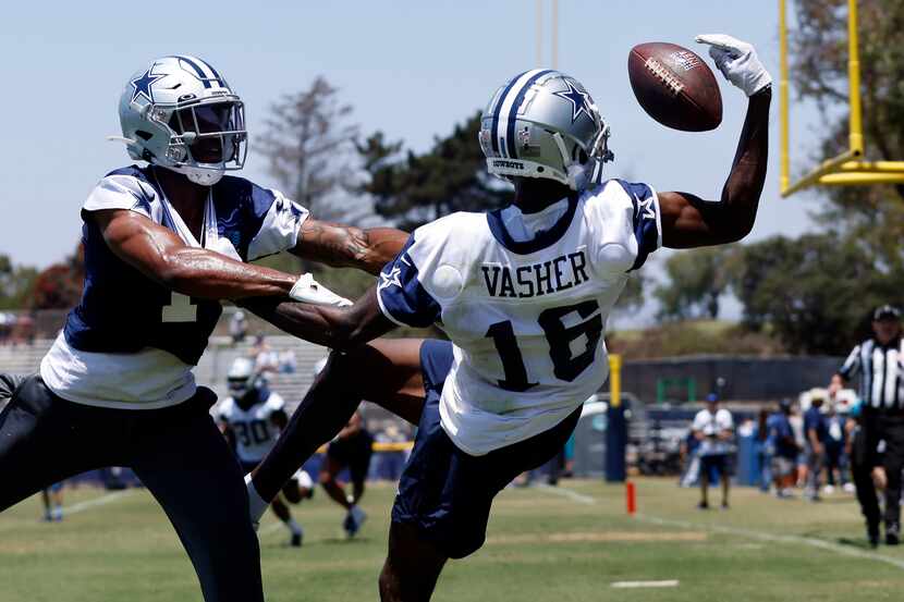 Dallas Cowboys wide receiver T.J. Vasher (16) makes a one-handed grab as he’s covered by...