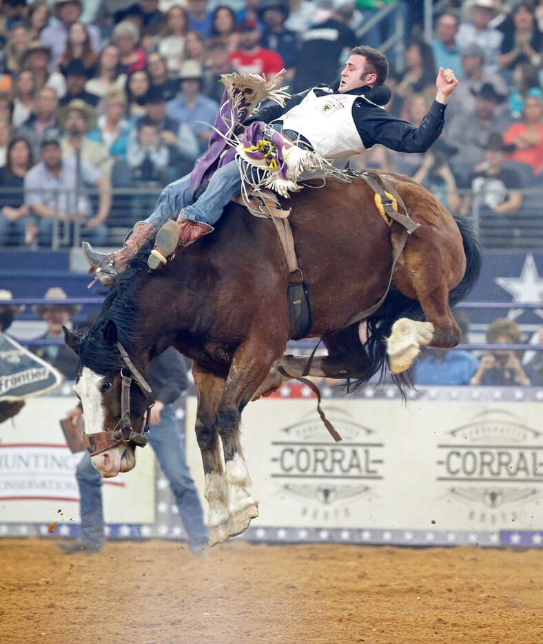 Kaycee Feild rides in the bareback event during RFD TV's "The American rodeo" at AT&T...