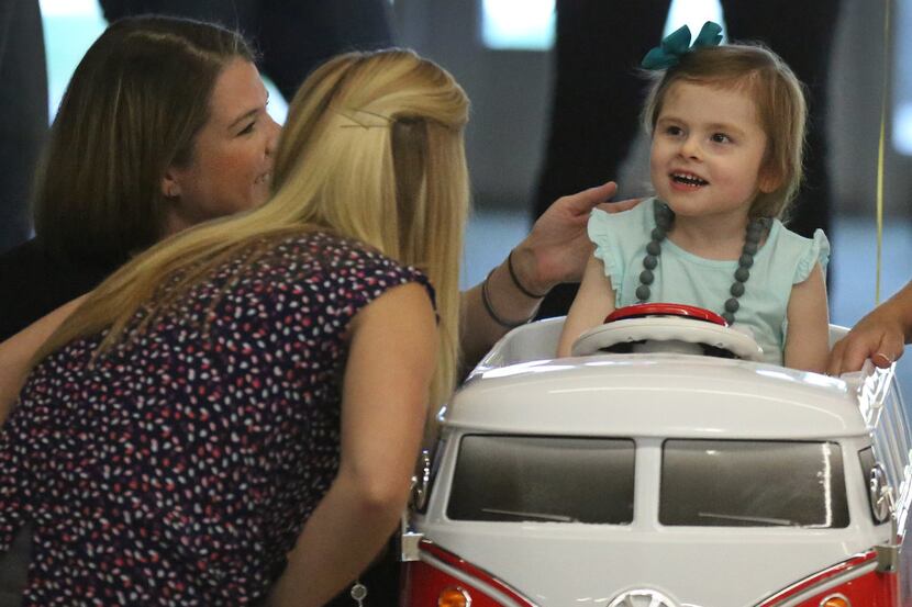 Abbi Jackson, 3, visits with her mother Meggan Jackson, left, and therapist Aubrey Selbo, as...