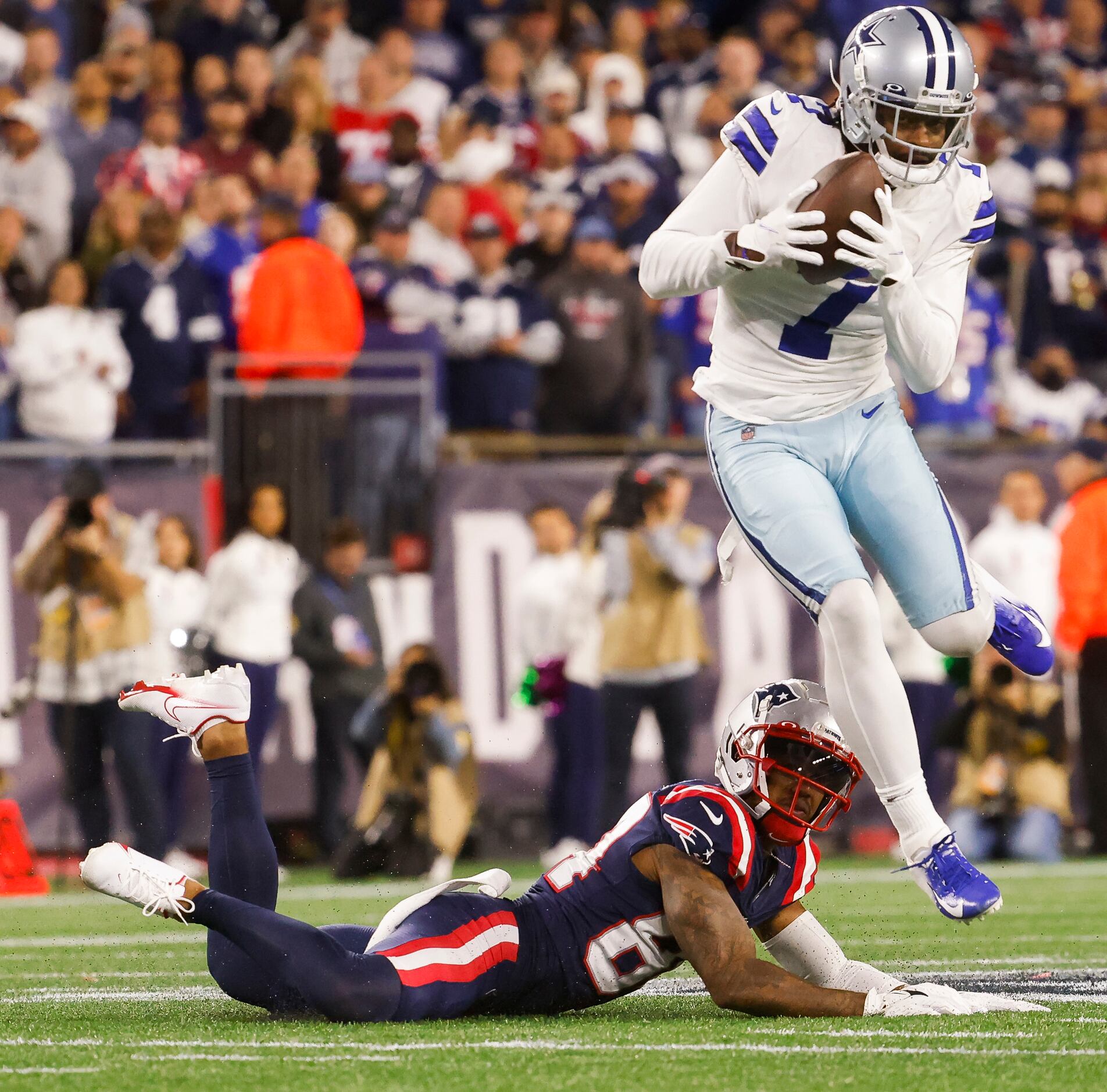 Dallas Cowboys cornerback Trevon Diggs (7) jumps over New England Patriots wide receiver...