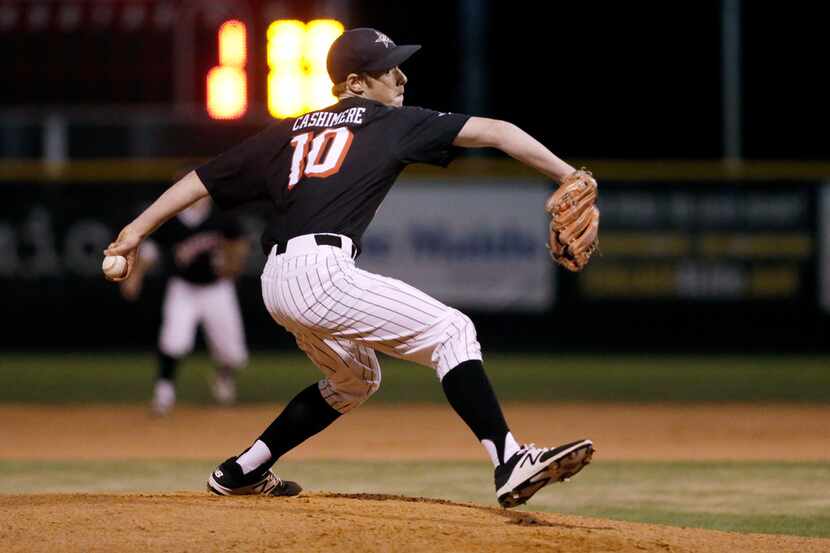 Coppell starting pitcher John Cashimere throws during the first inning of a high school...