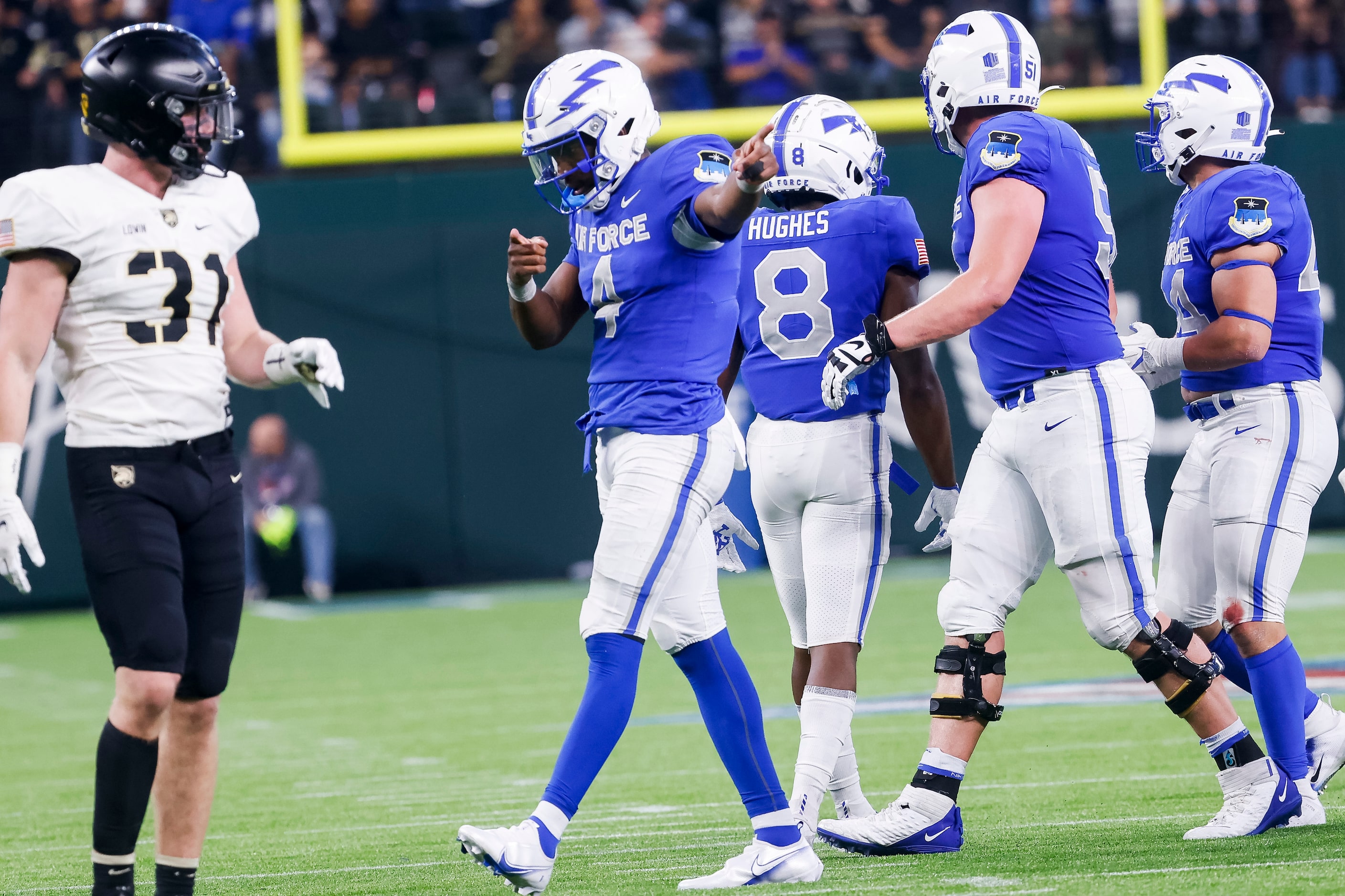 Air Force Falcons quarterback Haaziq Daniels (4) celebrates a run against the Army Black...