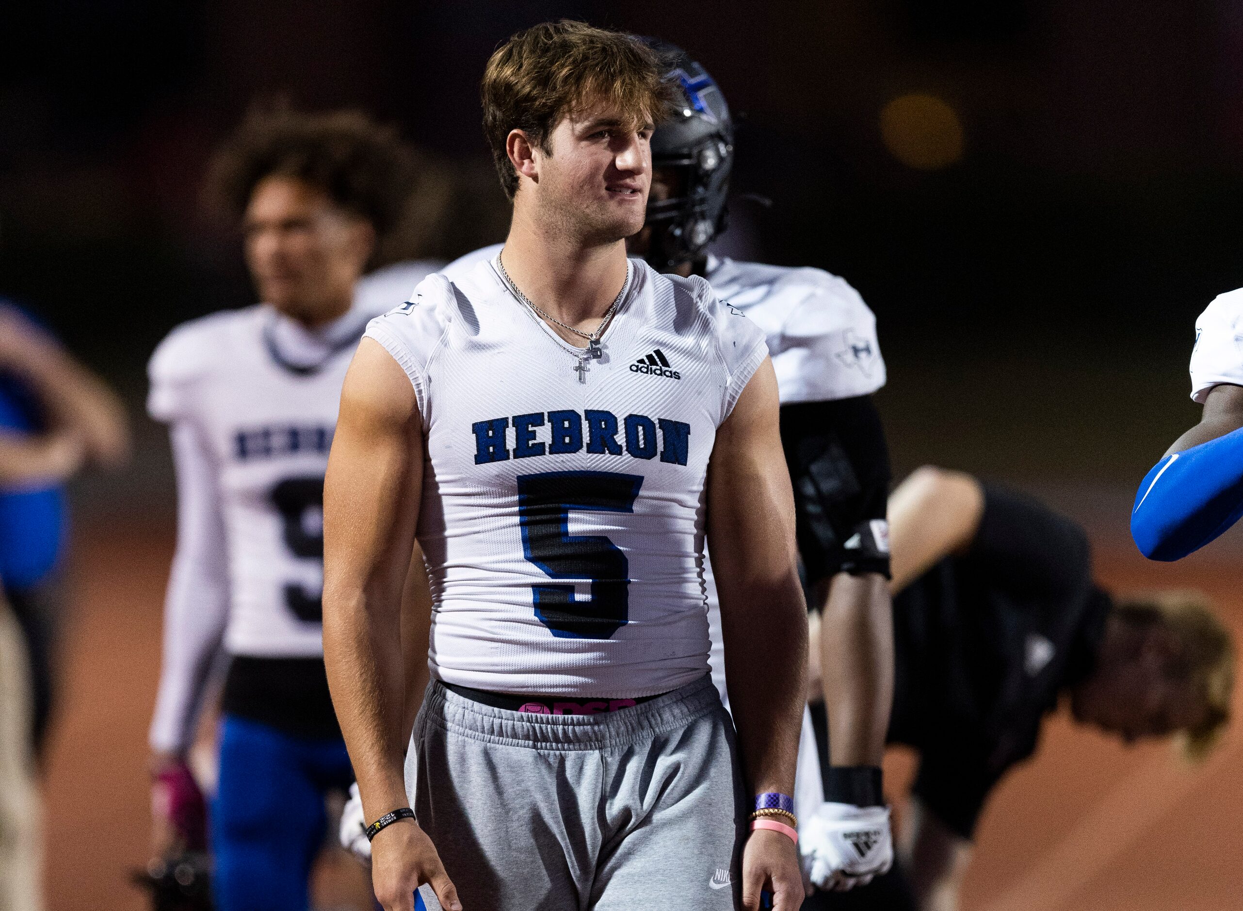 Hebron senior defensive back Carson Dean (5) is seen on the sidelines during the first half...