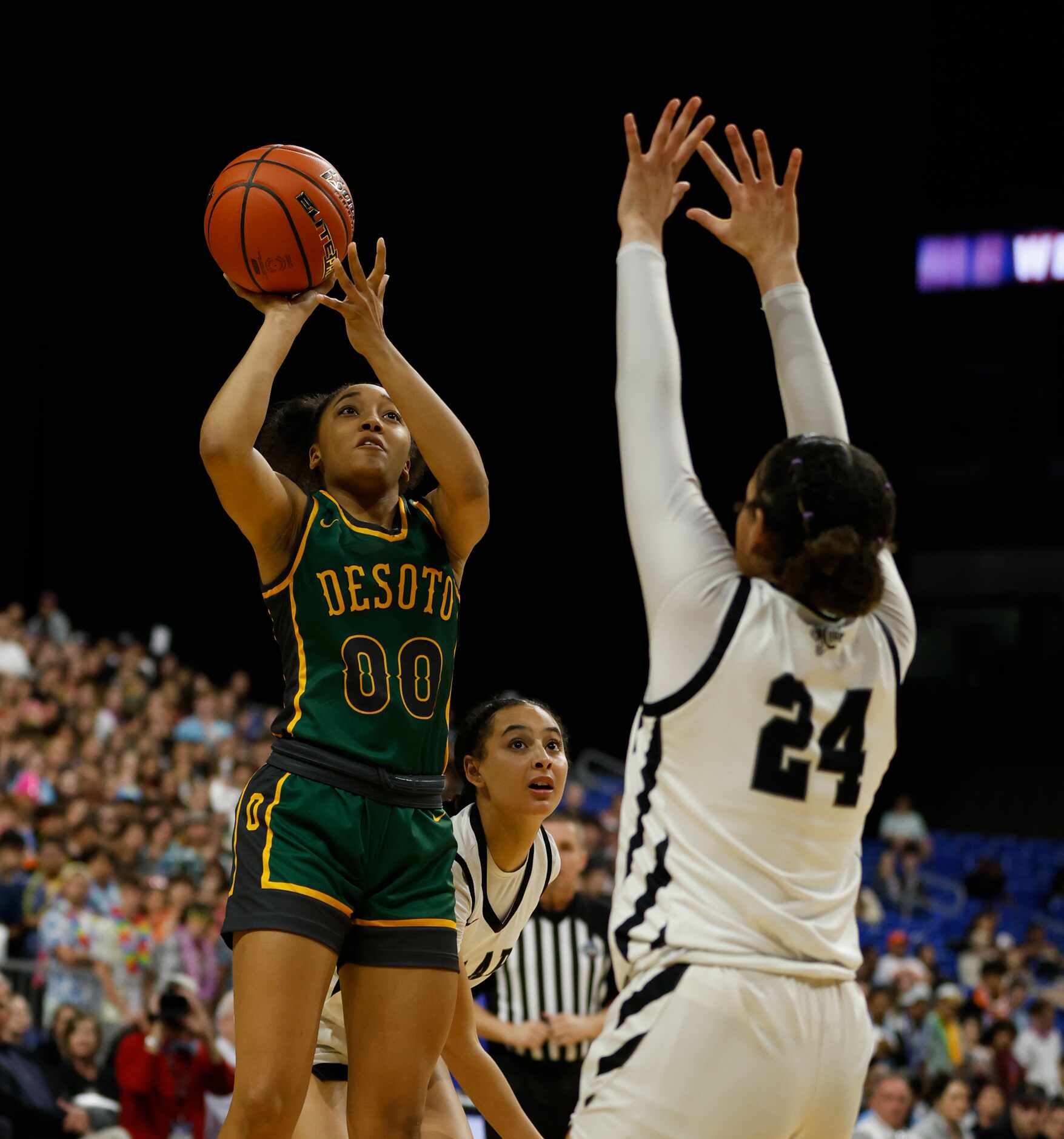 Desoto Mylasia Smith (00) shots over Clark Cougars’ Kamryn Griffin (24) in girls basketball...