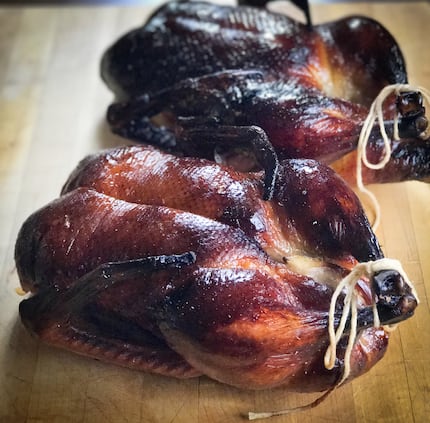 Two ducks serve as the main event at a holiday dinner for four to six people.