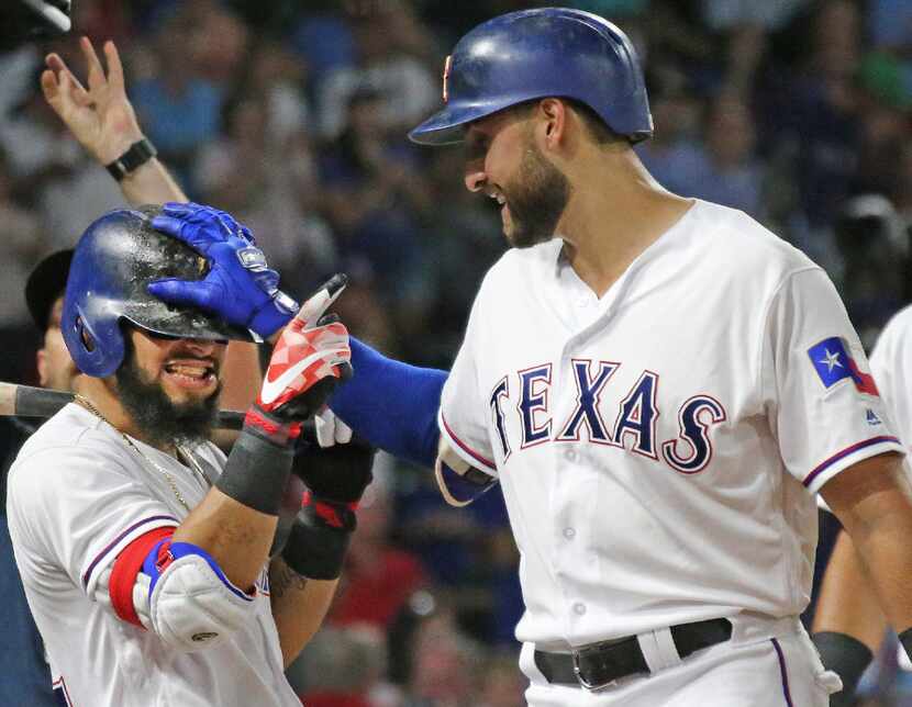 Texas Rangers third baseman Joey Gallo, right, celebrates his fourth-inning homer with...