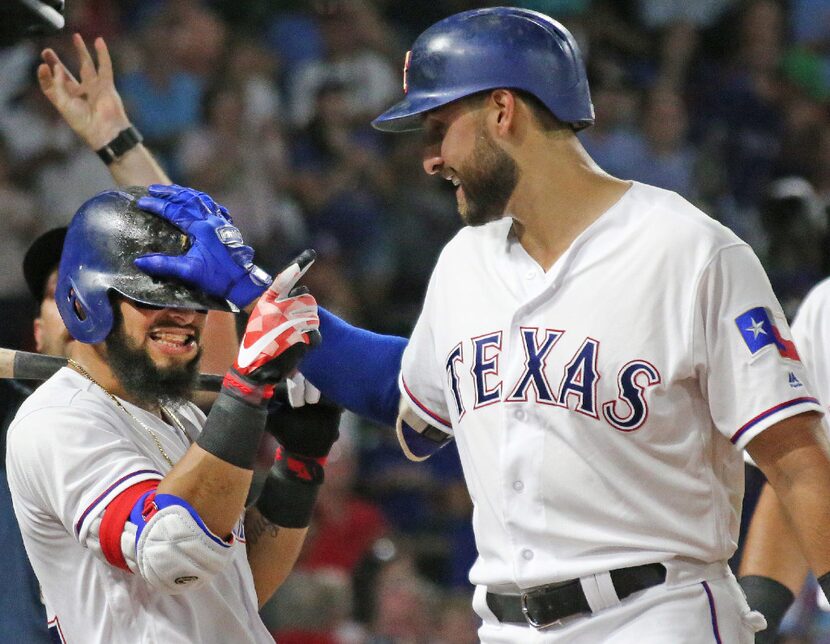 Texas Rangers third baseman Joey Gallo, right, celebrates his fourth-inning homer with...