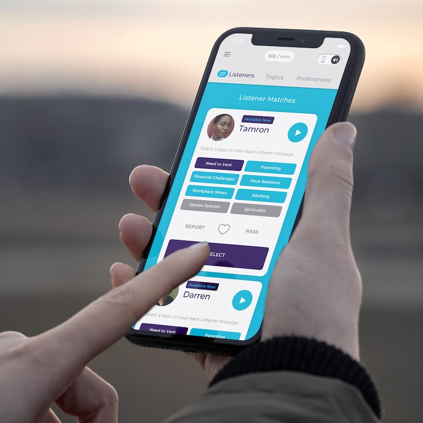 A person holding a phone and choosing from a menu of options on the Listeners On Call app.