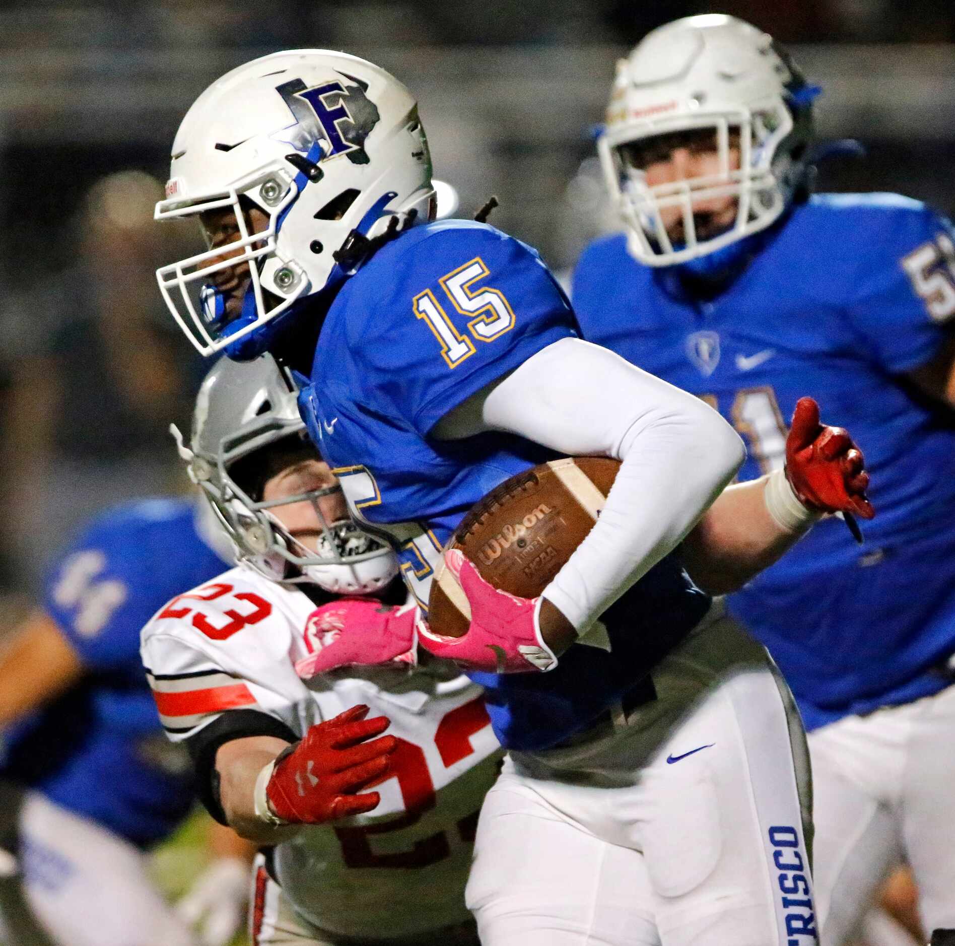 Frisco High School running back Ryan Taylor (15) is tackled for a loss by Lovejoy High...