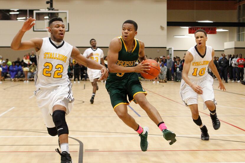 Madison guard Admon Gilder (3) drives on Triple A Academy guard King McClure (22)  and guard...