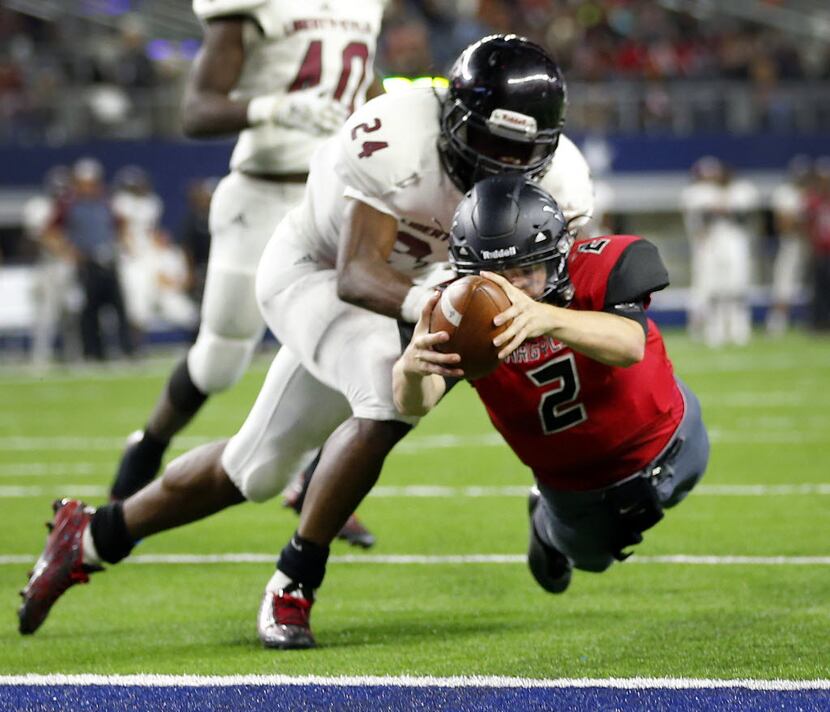 Argyle quarterback Dane Ledford (2) dives for the end zone and is tackled by Liberty-Eylau's...