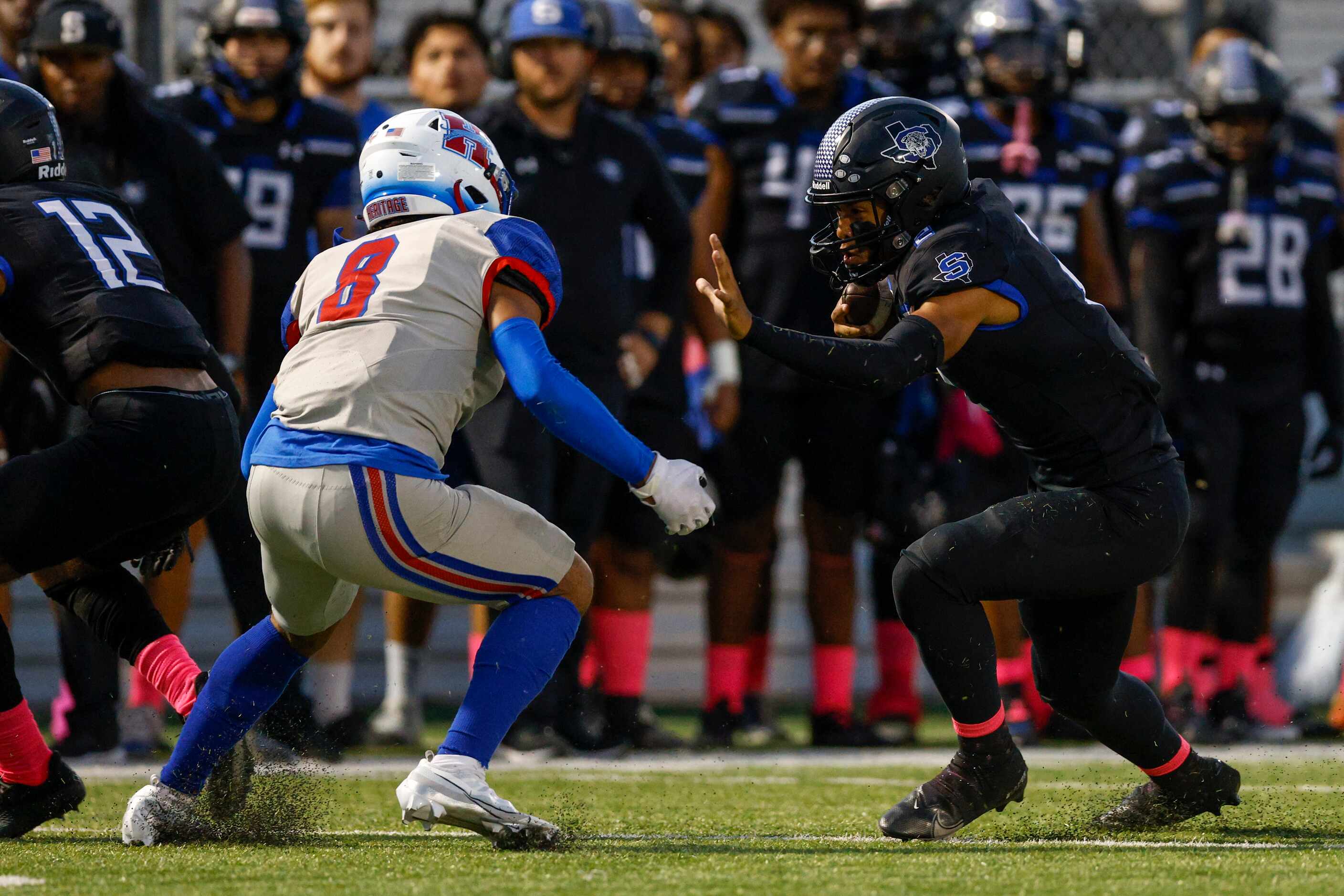 Mansfield Summit quarterback Joseph Williams (2) runs towards Midlothian Heritage defensive...