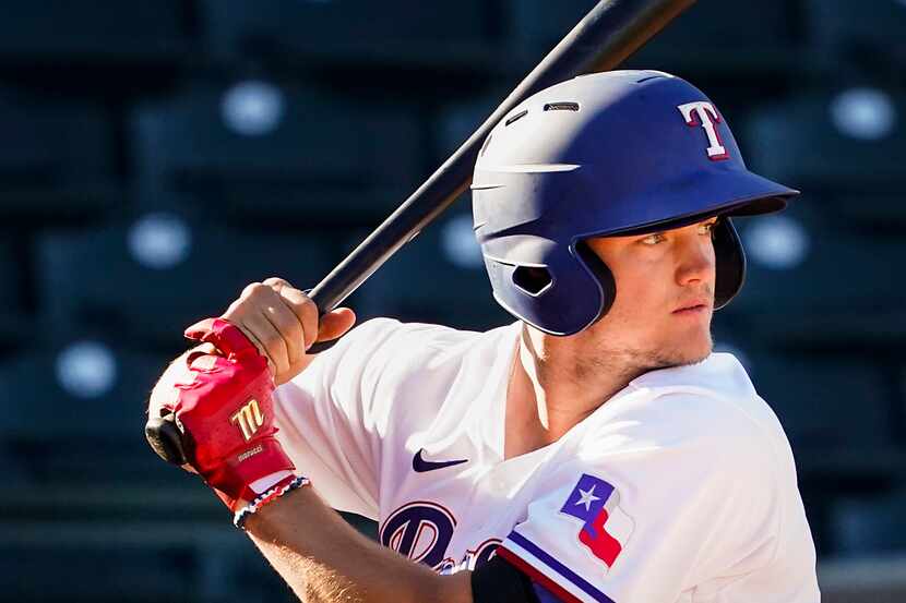 Texas Rangers third baseman Josh Jung bats during the ninth inning of a spring training game...