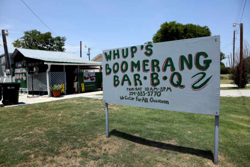 A hand-painted sign welcomes you to Whup's Boomerang Barbecue in Marlin. Whup's...
