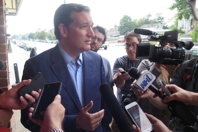  Sen. Ted Cruz speaks with reporters before an appearance at the Draft House in Concord,...