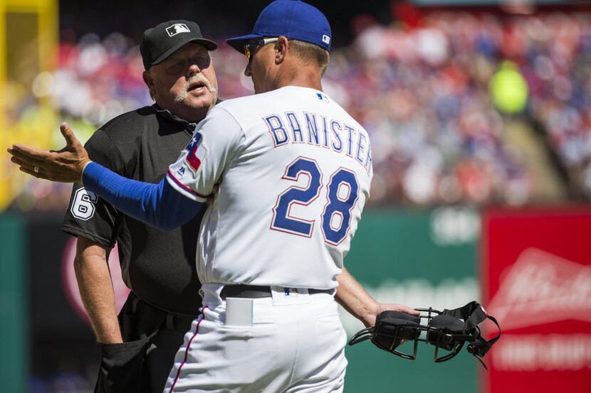 Texas Rangers manager Jeff Banister argues with umpire Jim Joyce during the first inning...