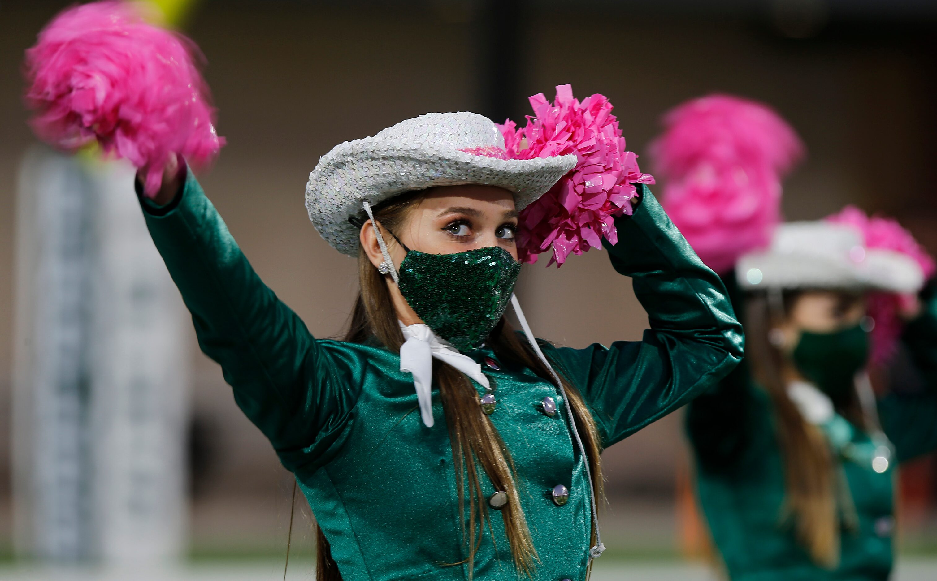 Lauren Memory, 14, with the Prosper High School Talonettes,  performs before kickoff  as...