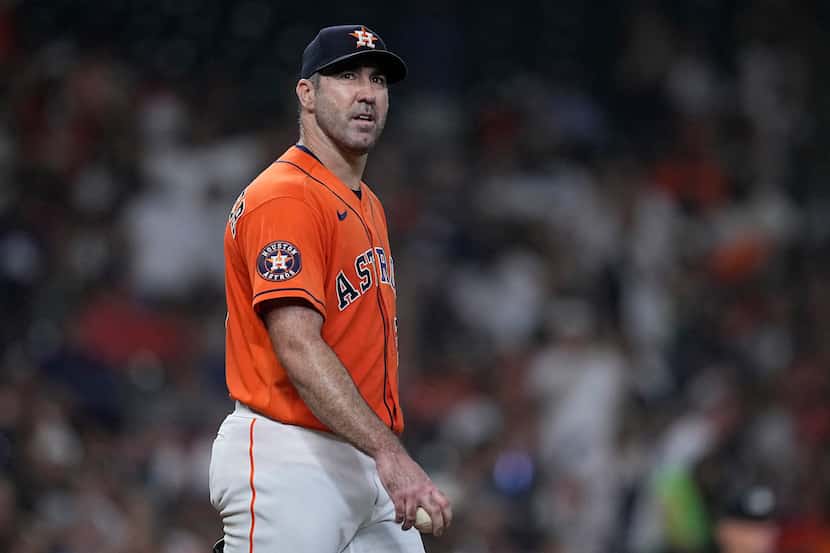 Houston Astros starting pitcher Justin Verlander pauses after giving up a two-run home run...