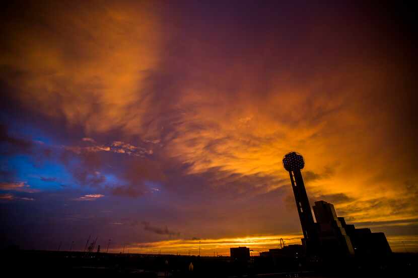 Storms move through down town Dallas at sunset on Friday, April 24, 2015. (Ashley Landis/The...