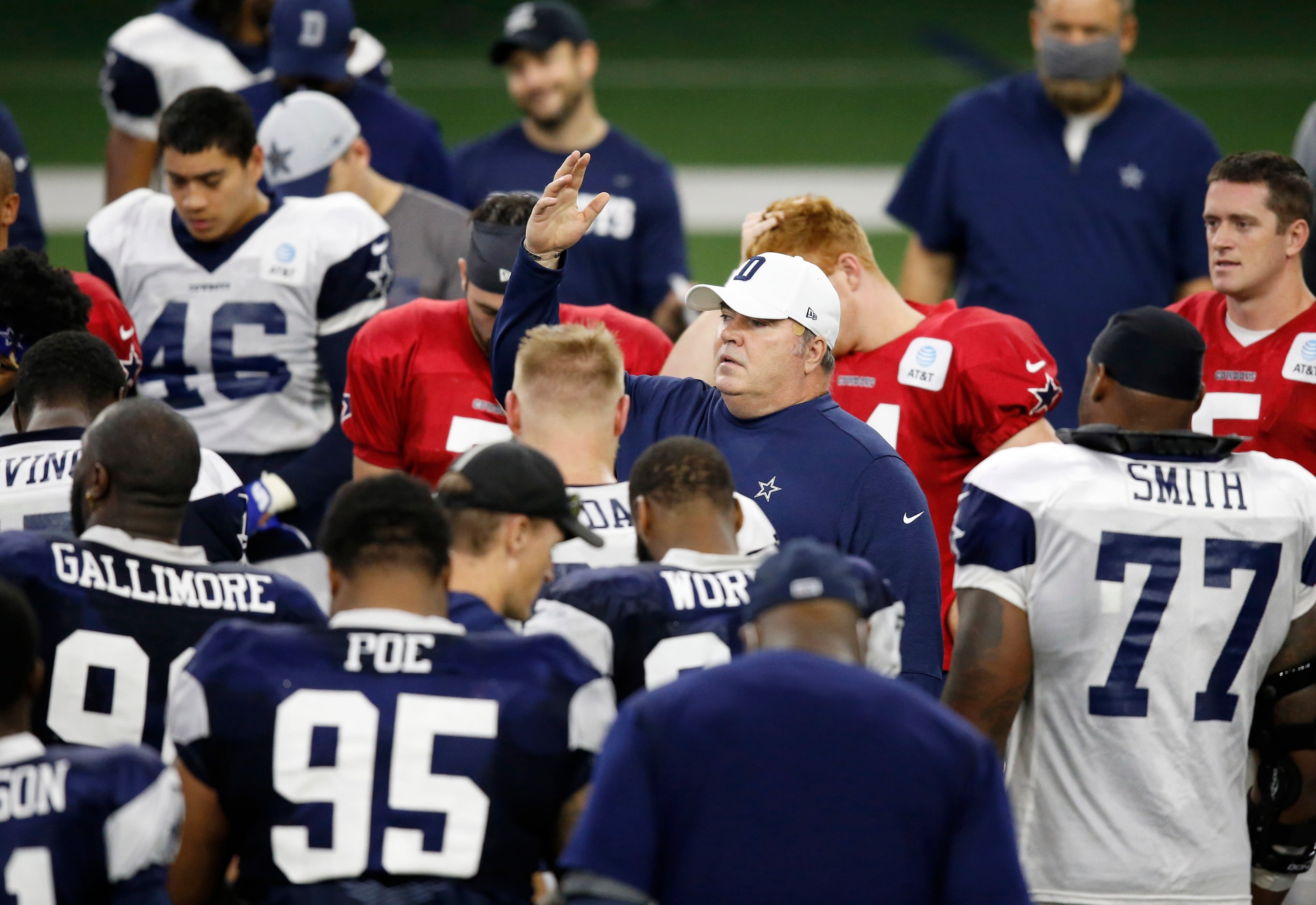 Dallas Cowboys head coach Mike McCarthy talks to the players after practice during training...