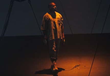 Fans could hardly see Kanye West on his moving stage because he performed mostly in the...