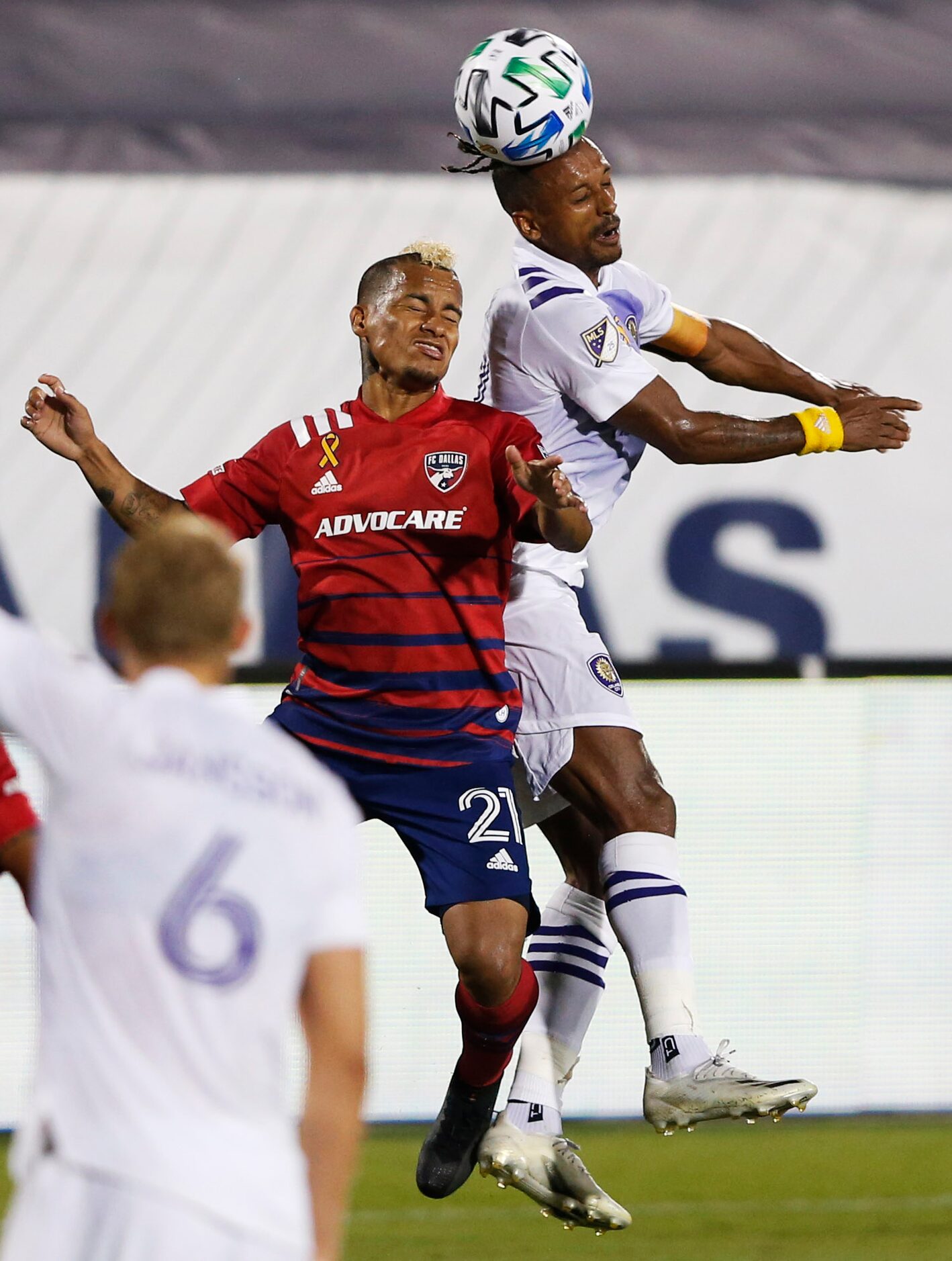 FC Dallas midfielder Michael Barrios (21) and Orlando City forward Nani (17) go up for the...