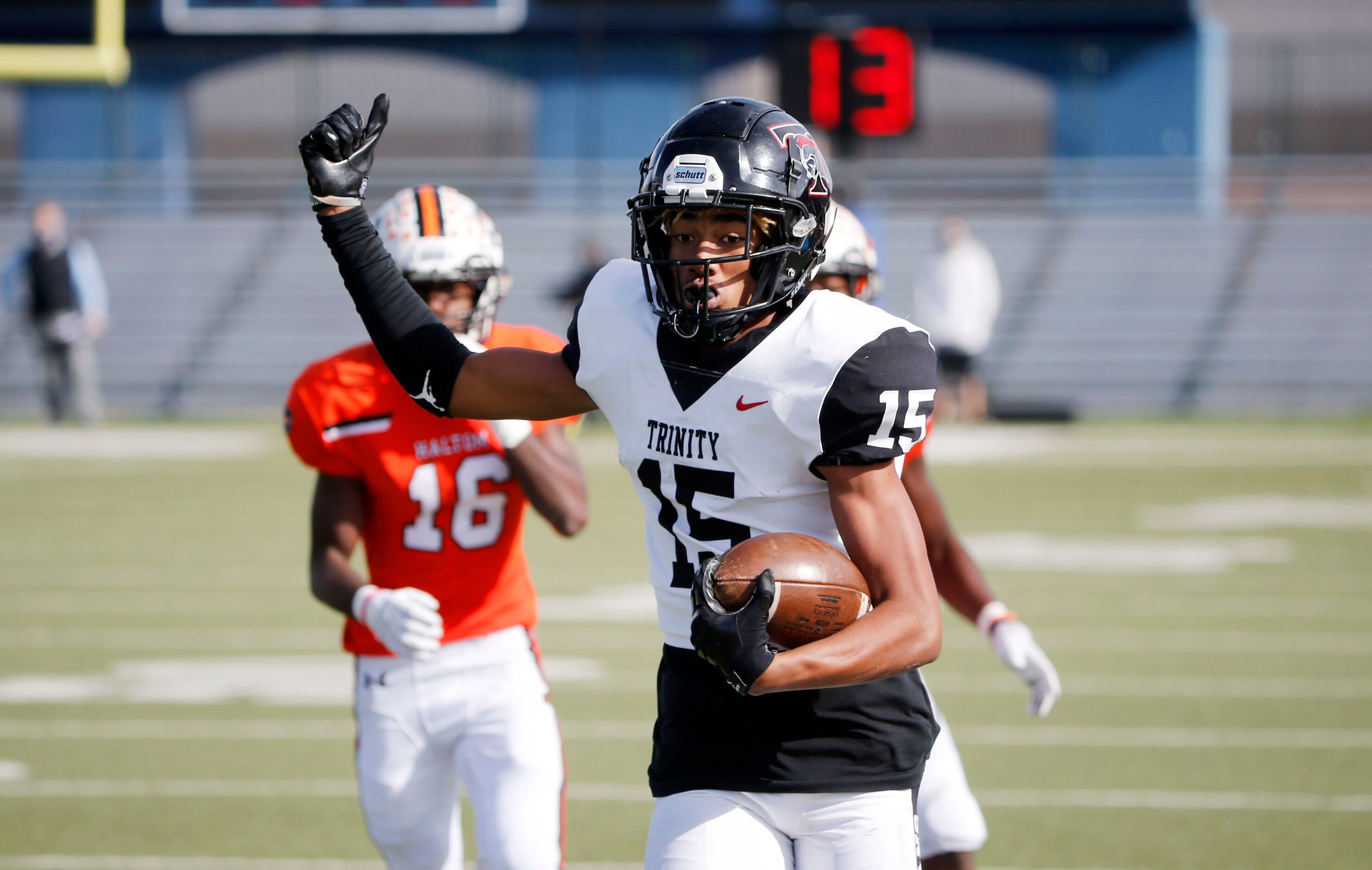 Euless Trinity wide receiver Pofele Ashlock (15) runs for a touchdown against Haltom during...