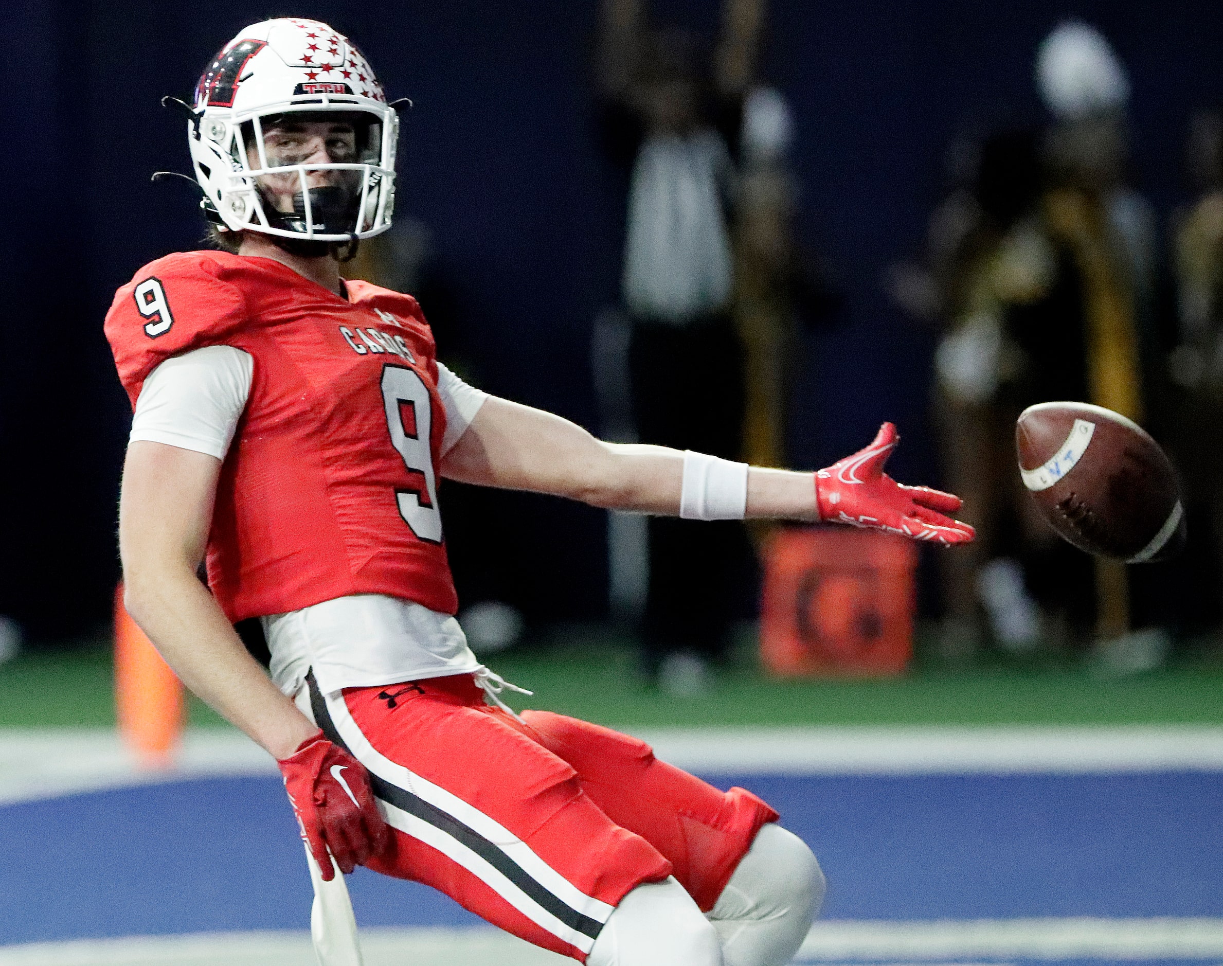 Melissa High School wide receiver Karson Maynard (9) tosses the football after reaching the...