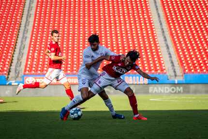 #43 Jonathan Gomez holds off a Tormenta FC attacker in USL League One action. #25 Callum...