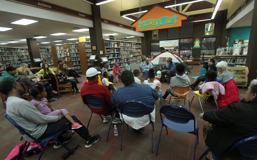 Gene and Peggy Helmick-Richardson entertain children by telling campfire stories in the Zula...