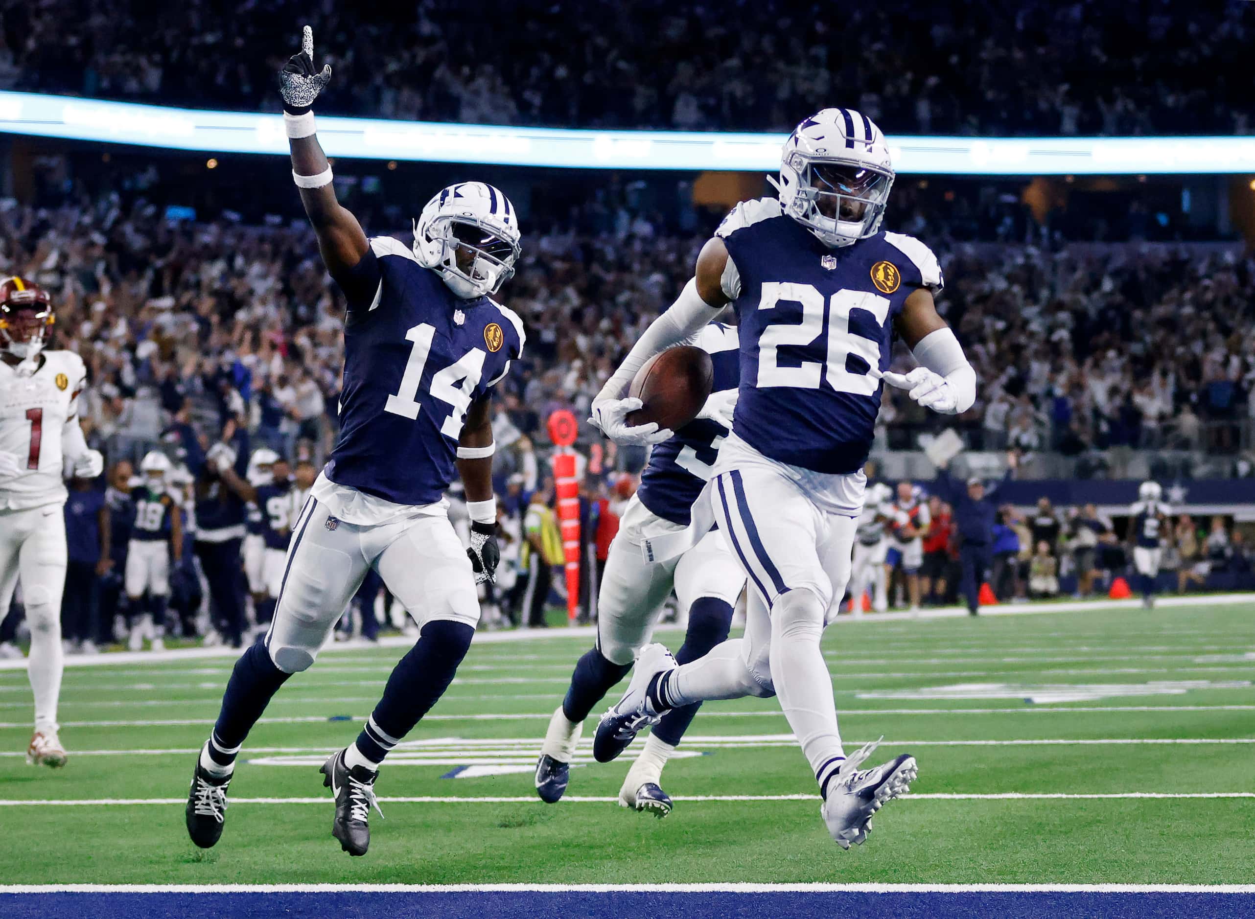 Dallas Cowboys cornerback DaRon Bland (26) returns  an interception for a touchdown as...