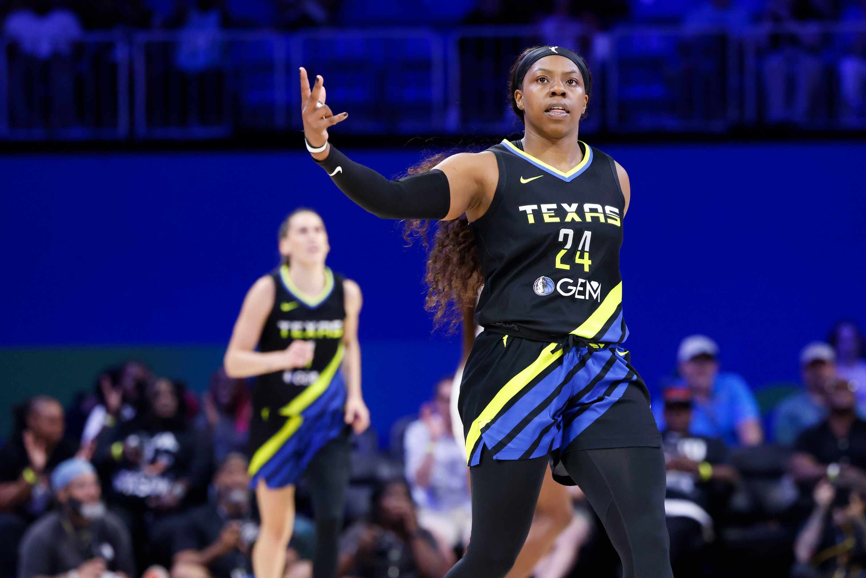 Dallas Wings guard Arike Ogunbowale reacts after scrogint a three-pinter against the Las...