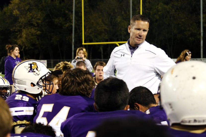 Denton Bronco head coach Kevin Atkinson, speaks to the team after a loss to the Northwest...