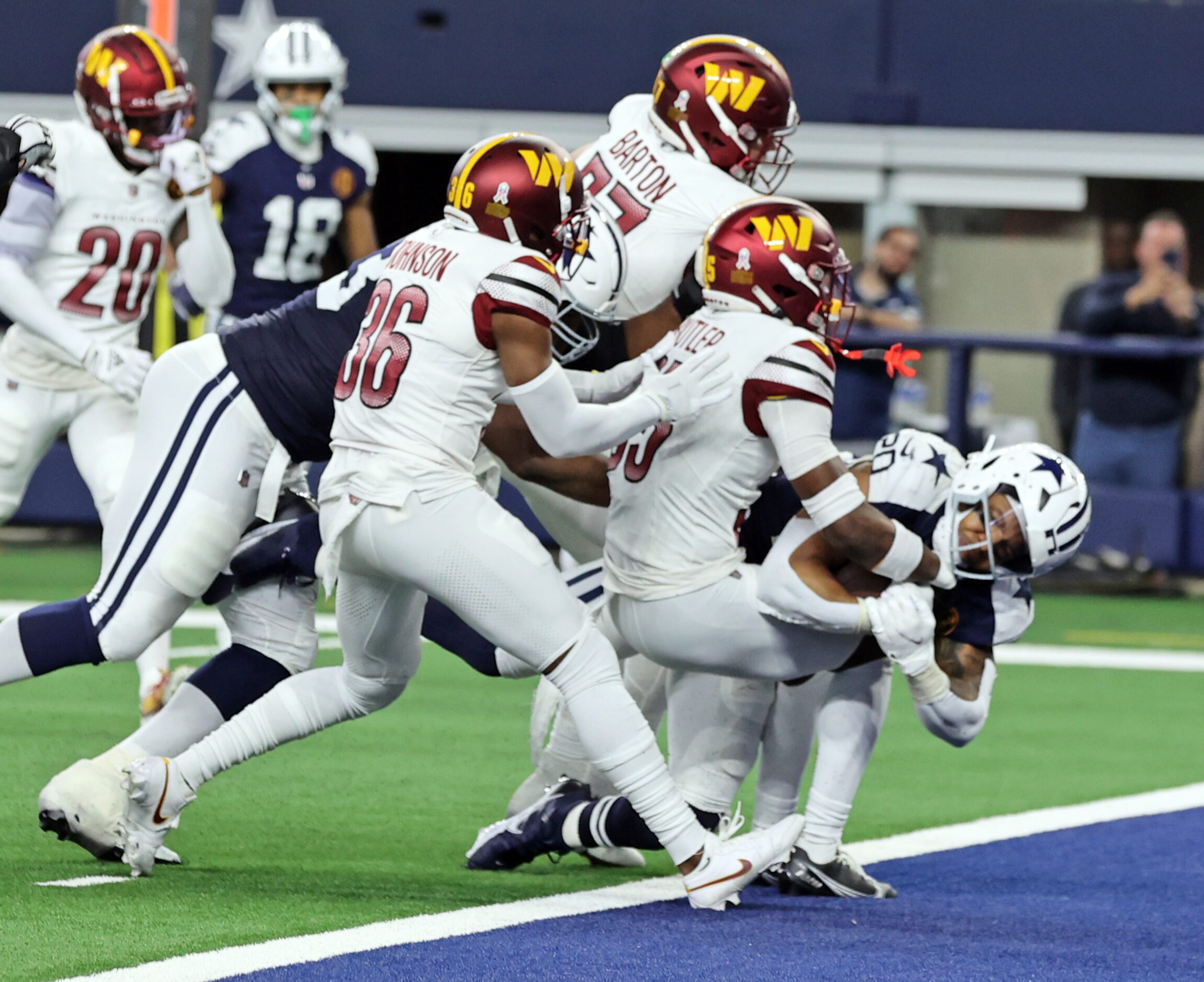 Dallas Cowboys running back Tony Pollard (20) drives across the goal line for the Cowboy’s...