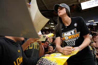 Iowa guard Caitlin Clark signs autographs during an Iowa women's basketball team...