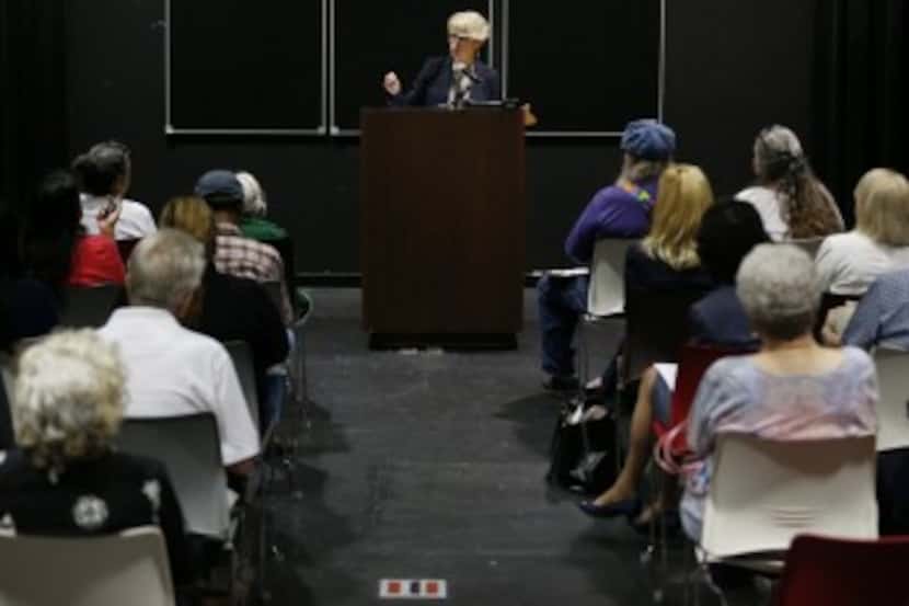  Susan Hawk speaks during a town hall meeting at the Pleasant Grove Public Library in Dallas...