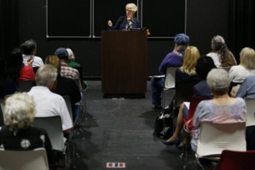  Susan Hawk speaks during a town hall meeting at the Pleasant Grove Public Library in Dallas...