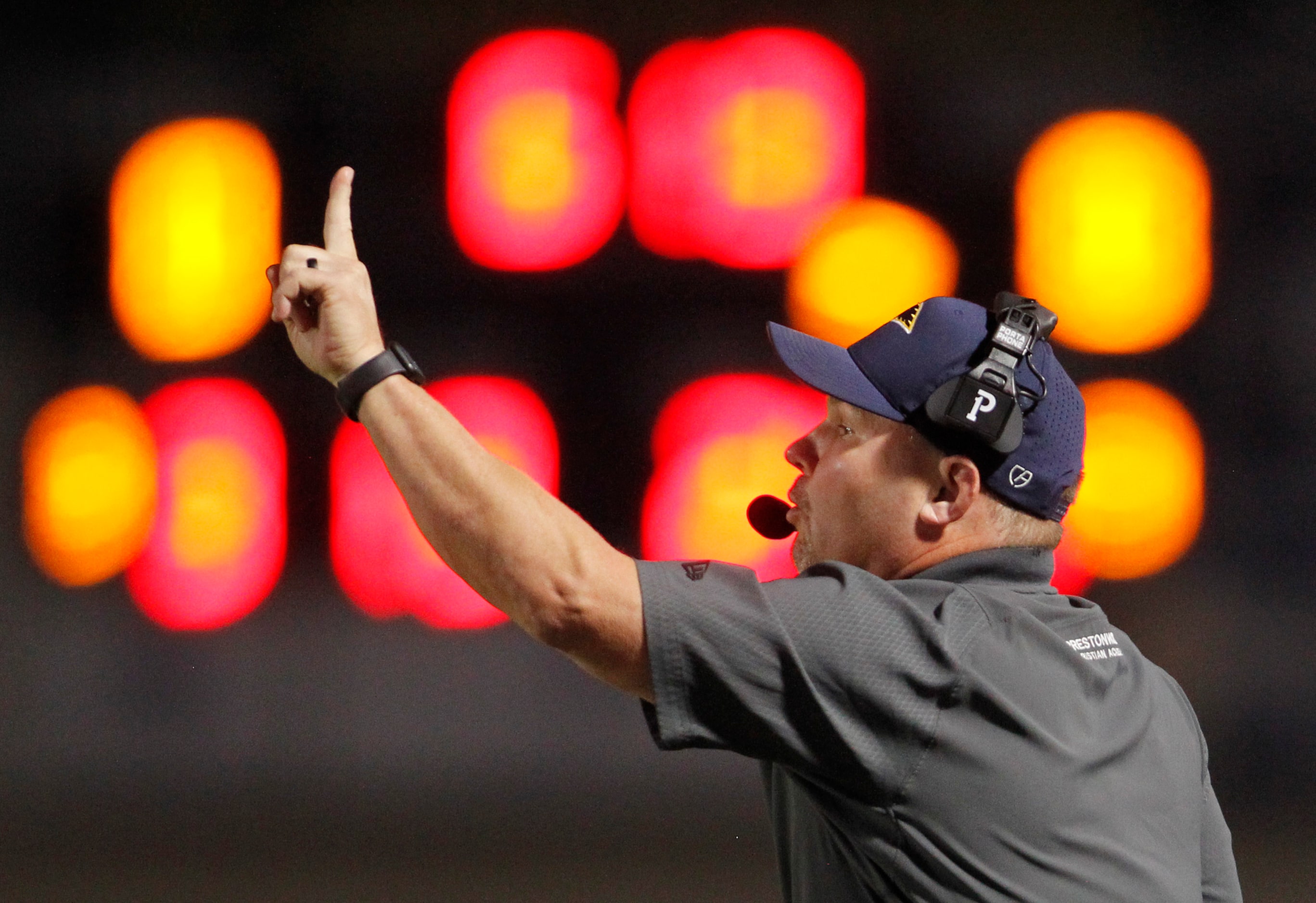 Plano Prestonwood Christian head coach Donnie Yantis sends a play in from the team bench...