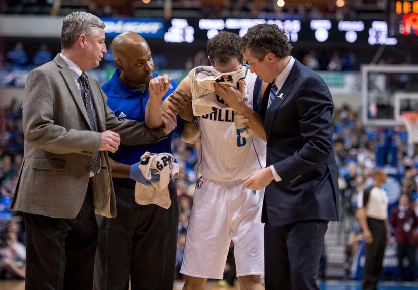 Mar 23, 2014; Dallas, TX, USA; Dallas Mavericks guard Jose Calderon (8) leaves the game with...