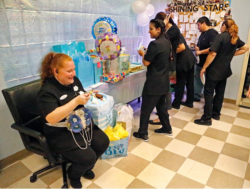 Housekeeping employee Christy Hubbard (left) of Fort Worth enjoyed a baby shower thrown for...