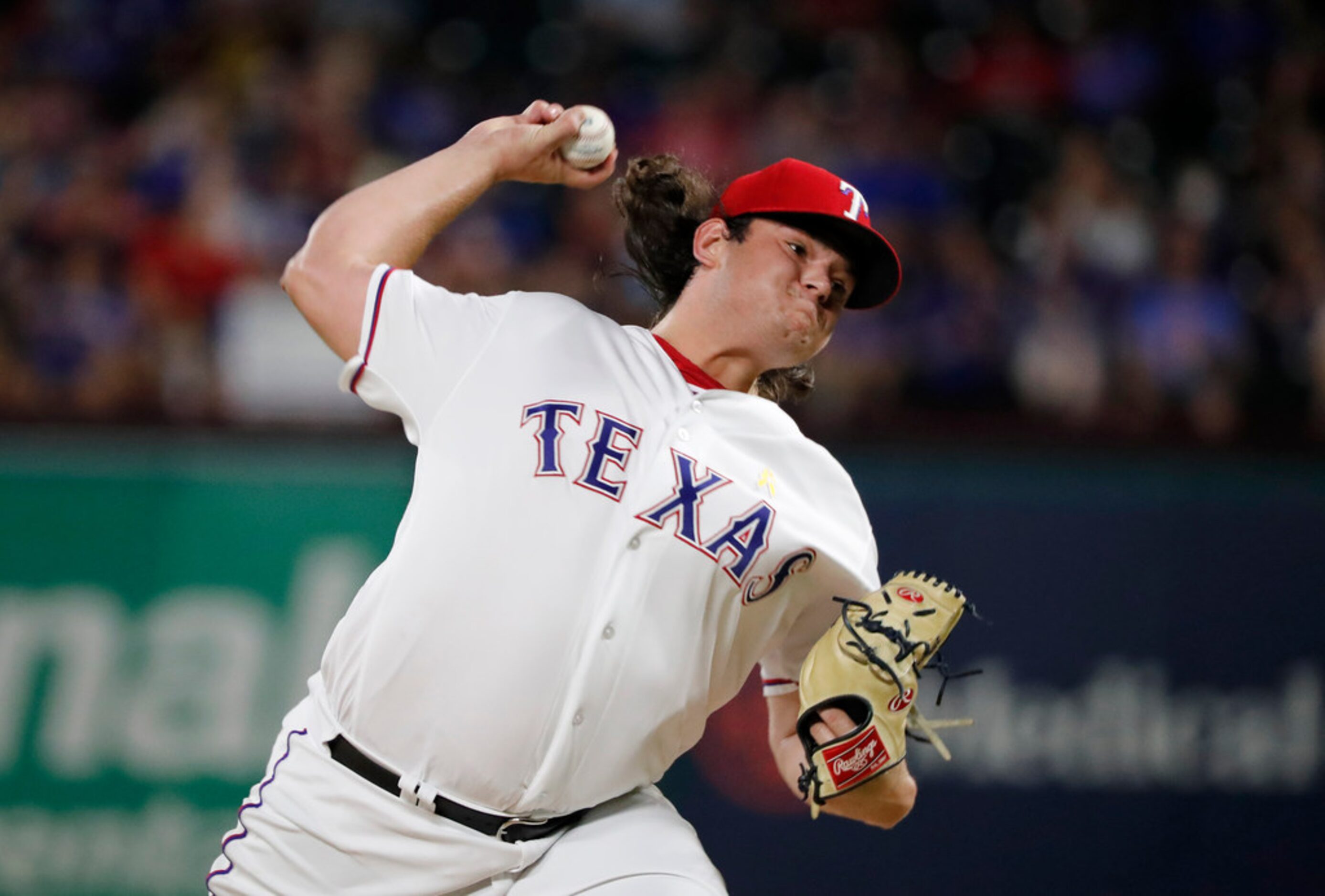 Texas Rangers' Ian Gibaut throws to the Oakland Athletics during the sixth inning of a...