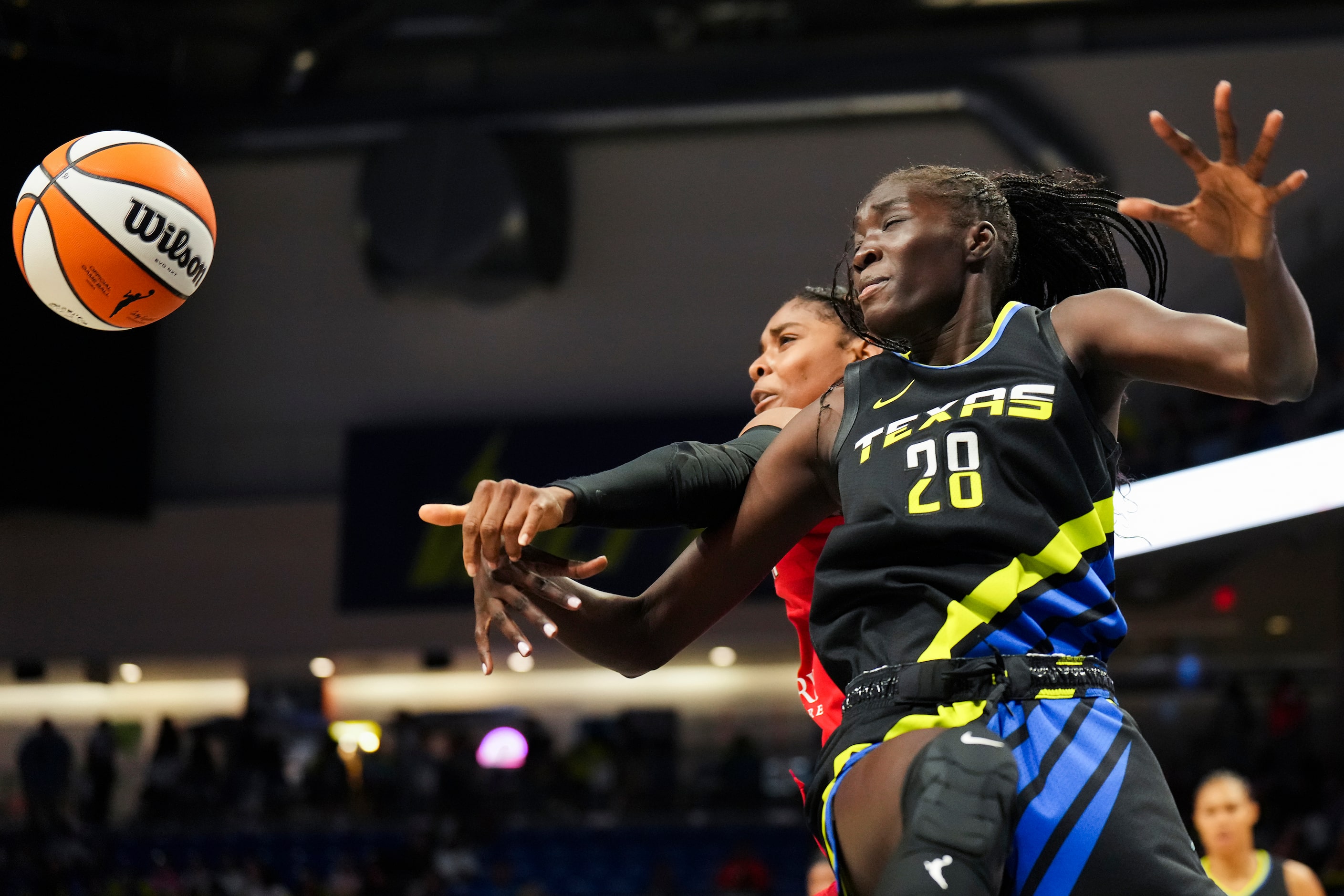 Dallas Wings forward Awak Kuier (28) fights for a rebound during the first half of a WNBA...