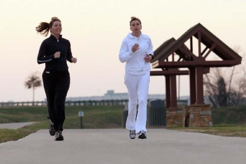 Runners jog along Irving's Campion Trail, which will soon connect to the city's downtown.